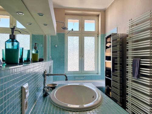 a bathroom with a large sink and a tub at Ferienwohnung Boppard in Boppard