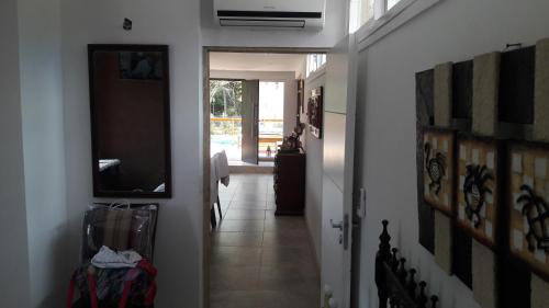 a hallway with a hallway leading to a room at Departamento con parque a metros del mar in Ostende