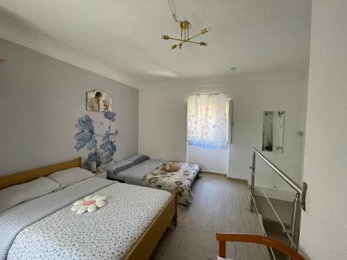 a bedroom with two beds and a window at Rifugio Nel Cuore Dell'Abruzzo in Carpineto Sinello