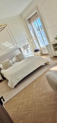 a bedroom with a bed and a large window at 'Blair' in ApartNest Auchterarder in Auchterarder