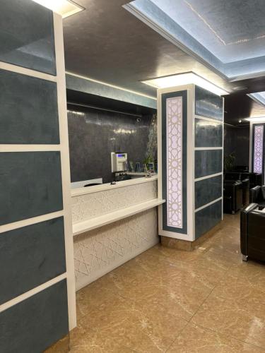 a lobby with a counter and a window in a room at Gold Hotel in Istanbul