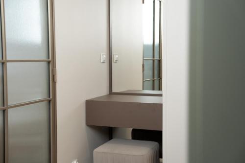 a bathroom with a sink and a mirror at Calma Apartament Moderato in Starogard Gdański