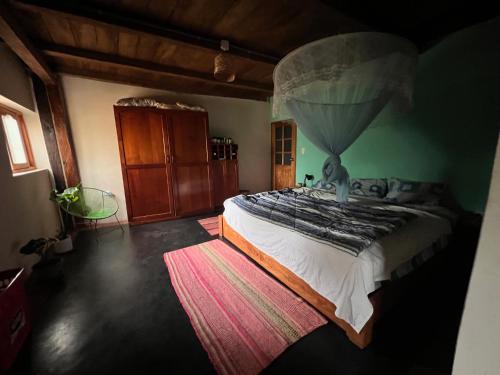 a bedroom with a large bed in a room at Wunderschönes Haus mit großer Terrasse in Sauce