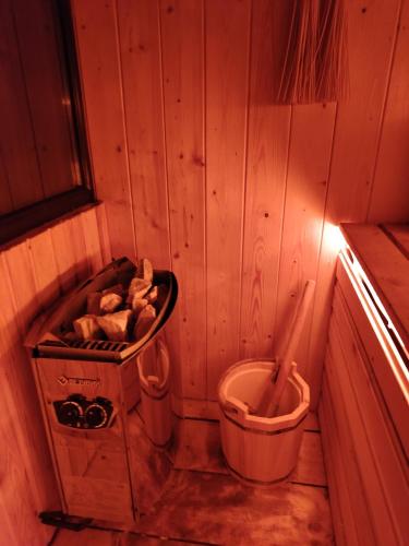 a small room with a toilet and a trash can at APARAN House in Aparan