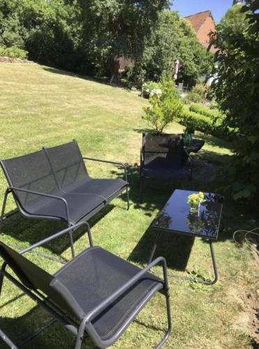 a chair and a table in a yard at Haus Engelbert in Höchheim