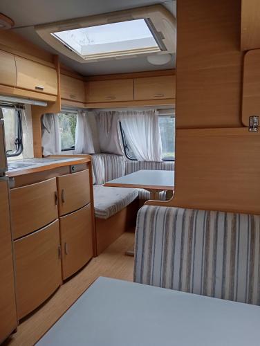 an interior view of a kitchen and living room in an rv at CCA area in Hio