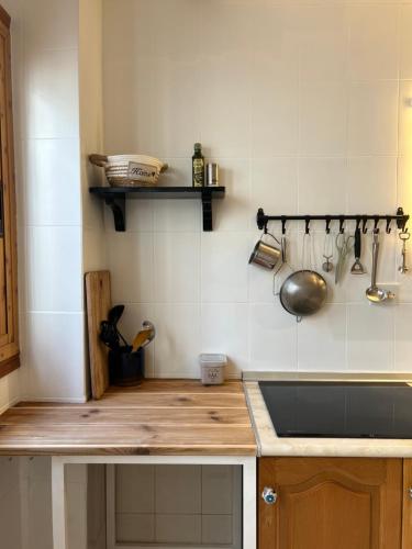 a kitchen with a sink and a counter top at Peaceful Townhouse Retreat in Órgiva