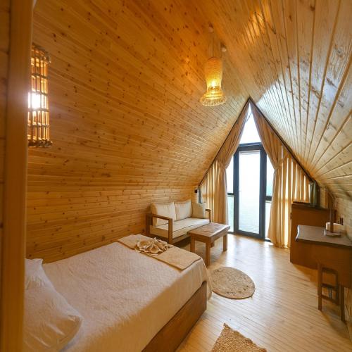 a bedroom with a bed in a wooden room at White Country Villages Hotel in Antalya