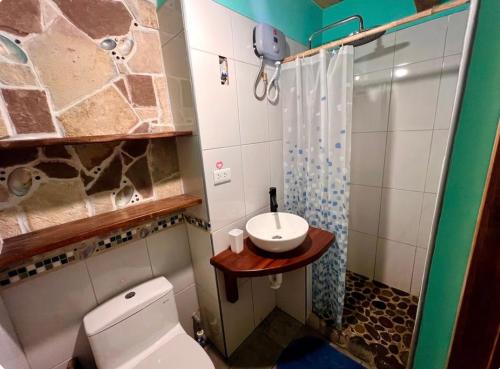 a bathroom with a toilet and a sink at Wunderschönes Haus mit großer Terrasse in Sauce