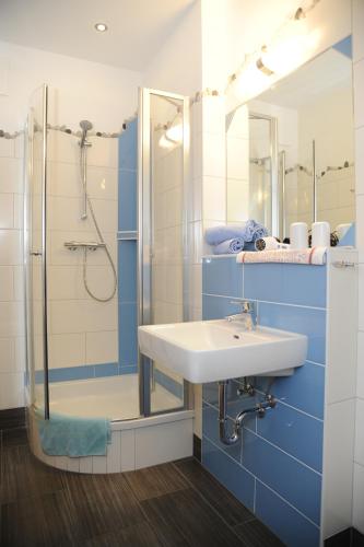 a bathroom with a sink and a shower at Branntweineralm in Tamsweg