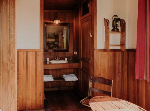 a bathroom with a sink and a mirror at La Maison du Bassin in Cap-Ferret