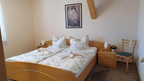 a bedroom with a bed with two plates on it at Ferienwohnung 2 in Bad Wilsnack
