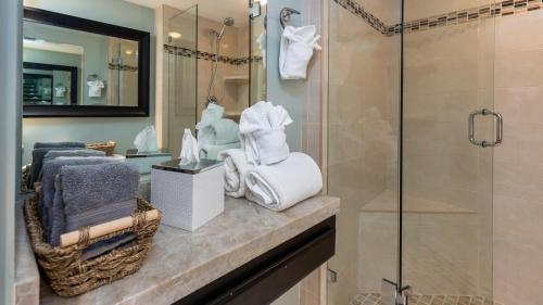 a bathroom with a shower and a counter with towels at 2402 Ocean Pointe in Tavernier