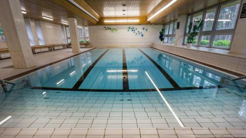 a large swimming pool in a large building at Hotel Bezdez Stare Splavy in Staré Splavy