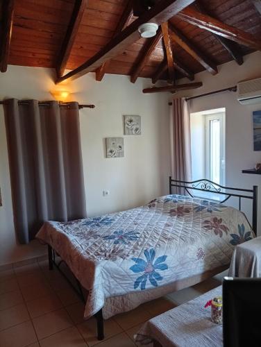 a bedroom with a bed in a room at Villa Fraoulitsa in Skoutari