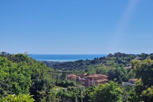 a view of the ocean from a house at Maison Diana in Vence