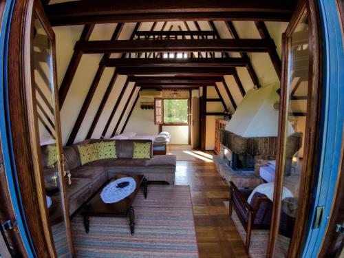 a living room with a couch and a table at Holiday Home Bojko in Krapje