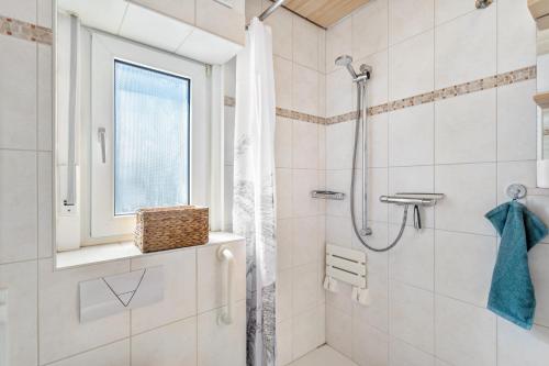 a bathroom with a shower with a glass door at Apartment Burgquartier in Schmallenberg