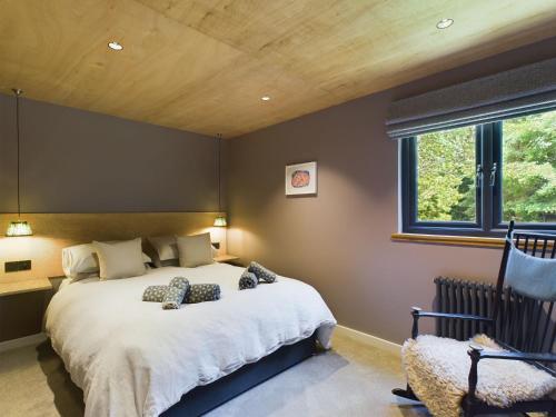 a bedroom with a large bed and a window at Hygge House in Woodside