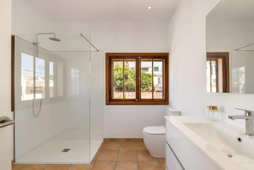 a bathroom with a shower and a toilet and a sink at Ca Ne Margalide - Andratx in Port d'Andratx