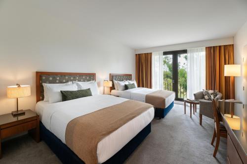 a hotel room with two beds and a window at Yarra Valley Lodge in Wonga Park