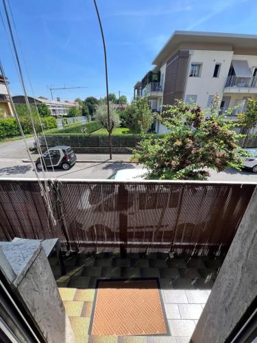 a balcony with a view of a parking lot at Easy Bergamo Apartment in Bergamo