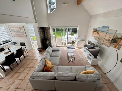 a living room with a couch and a table at Ooghduyne 89 in Julianadorp