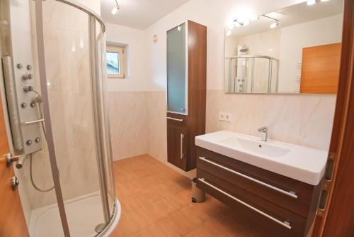 a bathroom with a sink and a shower at EK-Living in Fügen
