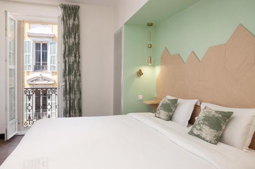 Krevet ili kreveti u jedinici u okviru objekta Hotel Florence Nice