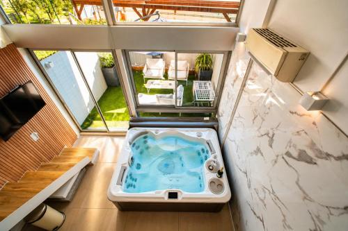 an overhead view of a bath tub in a room at Villa Bono Romantic Suite & Private Jacuzzi in Saint-Laurent-du-Var