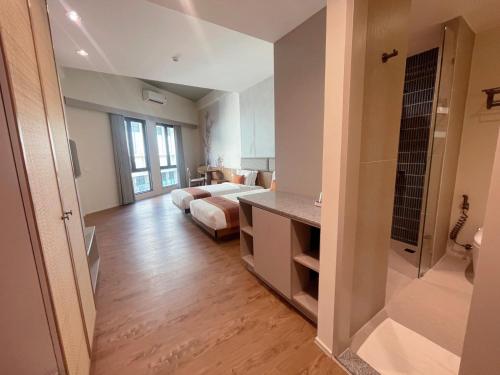 a hotel room with a bed and a bathroom at Taladnoi 24 Hostel in Bangkok
