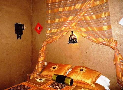 Katil atau katil-katil dalam bilik di La Vallée des Dunes - Auberge, bivouacs et excursions