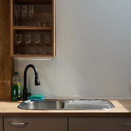 a kitchen with a sink and a counter top at IškAAdventure-appertment in Ig
