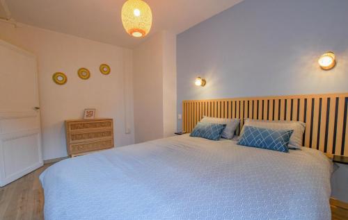 a bedroom with a large bed and a wooden headboard at Chez nenette in Prugny