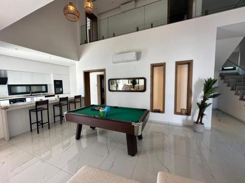 a living room with a pool table in it at Villa Donia in Mezraya
