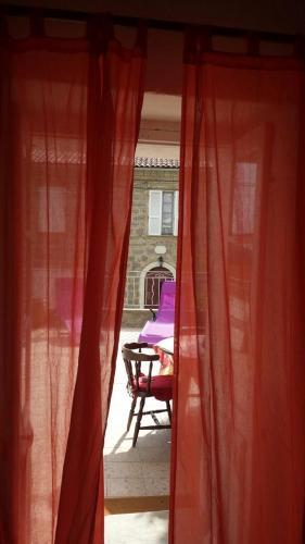 a view from a window of a table and a chair at Studio de la maison Lilas in Pila-Canale