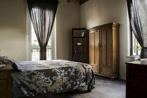 Giường trong phòng chung tại Antico Borgo