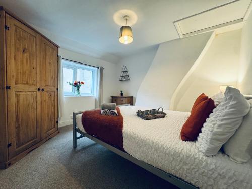 a bedroom with a bed and a window at Scotch Terrace - 3 Bedrooms - Sleeps 6 in Whitehaven