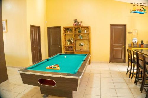 a pool table in the middle of a room at Paradise home in Rancho Percebu in San Felipe