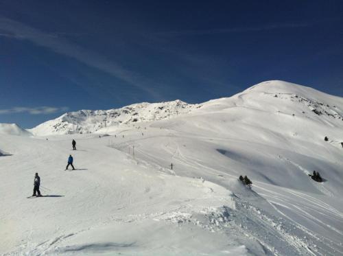 a group of people skiing down a snow covered mountain at Ferienhaus Berghof in Gerlos