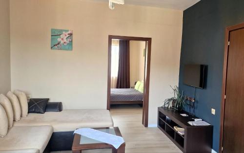 a living room with a couch and a room with a bedroom at Belogradchik View Apartment in Belogradchik