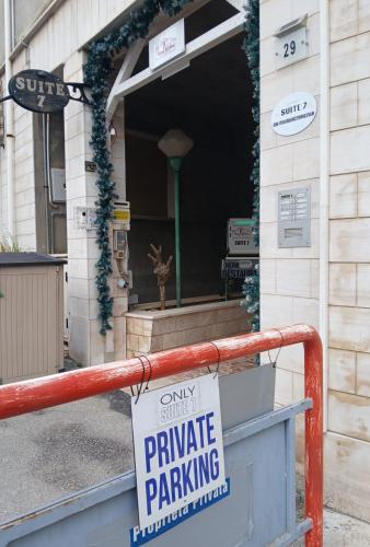 a private parking sign in front of a building at Suite seven &Home Restaurant in Paglieta