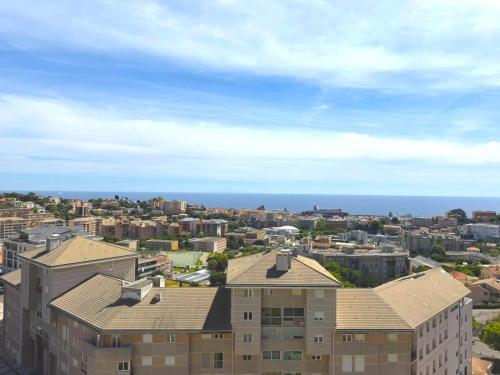 an aerial view of a city with buildings and the ocean at Studio climatisé avec vue mer in Bastia