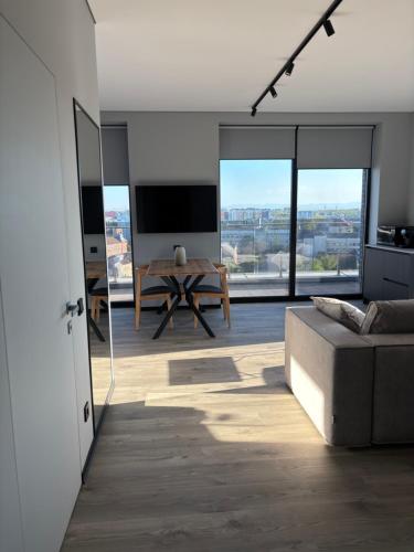 a living room with a couch and a table at Bavaro apartments 4 in Ivano-Frankivsk