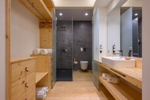 a bathroom with a sink and a shower at Dream Guincho in Cascais