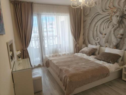 a bedroom with a bed and a large window at Joy Escape Varna in Varna City