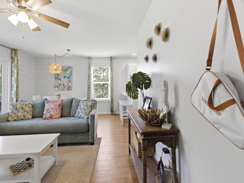 a living room with a couch and a table at Beachside Villas #821 - Dreamweaver in Seagrove Beach