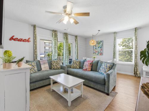 a living room with a couch and a table at Beachside Villas #821 - Dreamweaver in Seagrove Beach