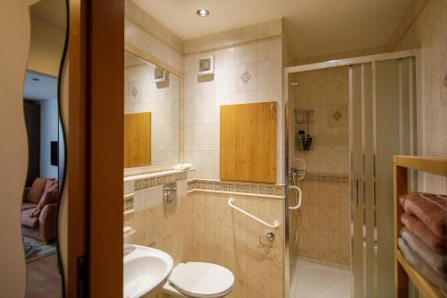 a bathroom with a toilet and a sink at Apartmán Brezy in Martinske Hole
