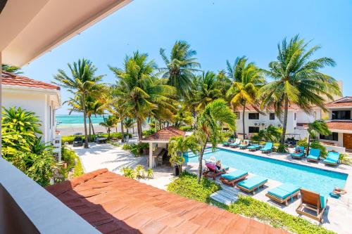 an aerial view of the resort pool and beach at Tradewinds Paradise Villas in San Pedro